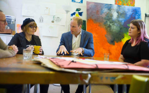 The prince talks with former clients Jason, Heather and Grace - Credit: DAVID ROSE/AFP/Getty Images