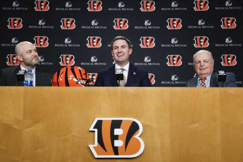 Cincinnati Bengals football head coach Zac Taylor, center, speaks alongside Bengals owner Mike Brown, right, and Duke Tobin, Bengals director of player personal, during a news conference, Tuesday, Feb. 5, 2019, in Cincinnati. After 16 years without a playoff win under Marvin Lewis, the Bengals decided to try something different. But they had to wait more than a month before hiring Zac Taylor as their next coach in hopes of ending a long streak of futility. (AP Photo/John Minchillo)