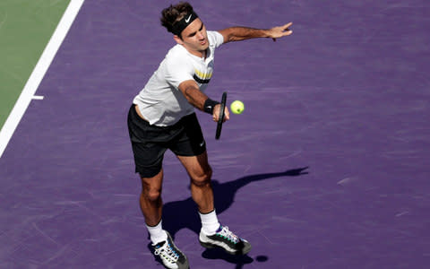 Roger Federer, of Switzerland, returns to Thanasi Kokkinakis, of Australia, during the Miami Open tennis tournament, Saturday, March 24, 2018 - Credit: AP