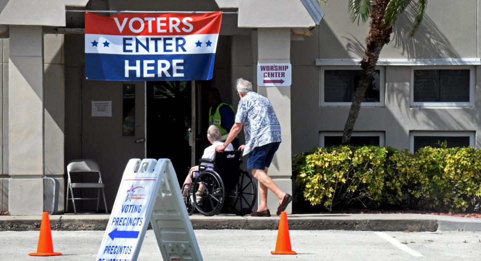 Voters enter Faith Fellowship Church in Melbourne to vote in the Aug. 23 primary.