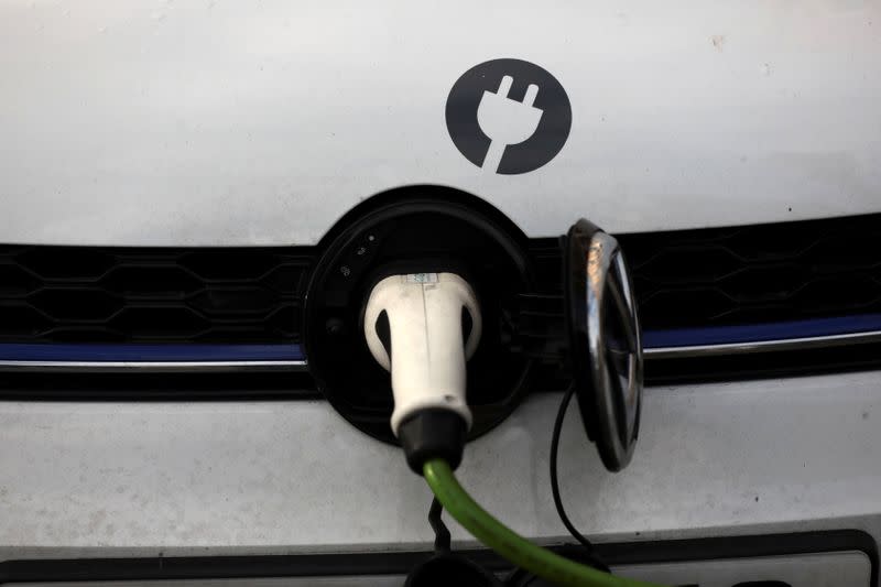 FILE PHOTO: A car is plugged in at a charging point for electric vehicles in London