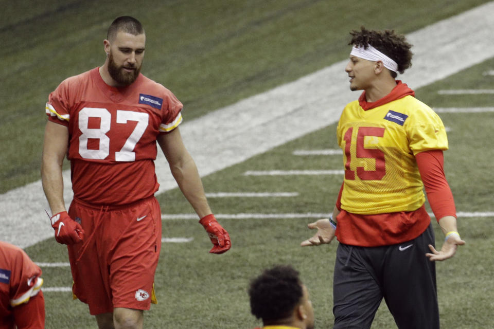 Kansas City Chiefs quarterback Patrick Mahomes (15) and tight end Travis Kelce (87) work out at NFL football practice Wednesday, Jan. 22, 2020 in Kansas City, Mo. The Chiefs will face the San Francisco 49ers in Super Bowl 54. (AP Photo/Charlie Riedel)