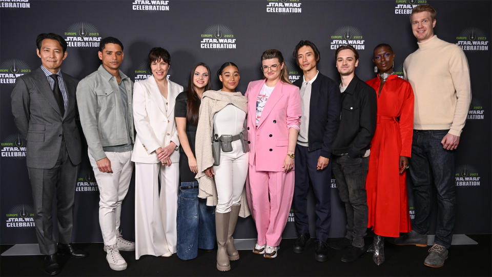 The cast and showrunner of The Acolyte pose for a photograph at Star Wars Celebration 2023