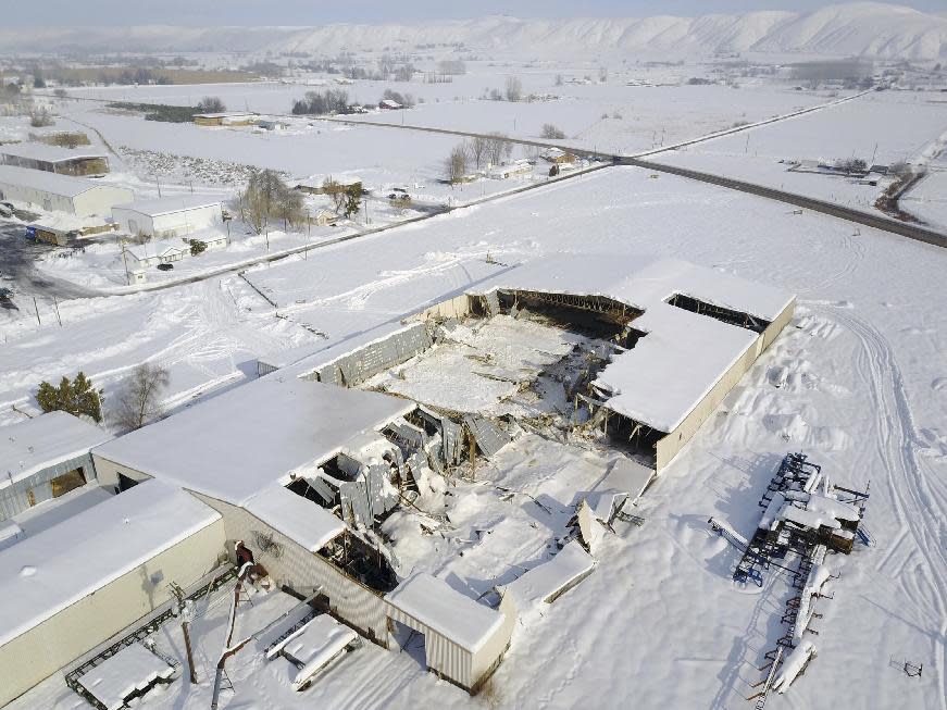 This Jan. 20, 2017 aerial image provided by Rapid Aerial LLC shows a Partners Produce facility in Payette, Idaho, that collapsed under the weight of snow. For buildings in parts of the snow-covered U.S. West, it has become a winter where the weak do not survive. The accumulated weight of snow has crushed an old lumber mill in Oregon, the main grocery store in a small Idaho town, a sports complex in Alaska and a conference center in Colorado, among others. (Jason Brainerd/Rapid Aerial LLC via AP)