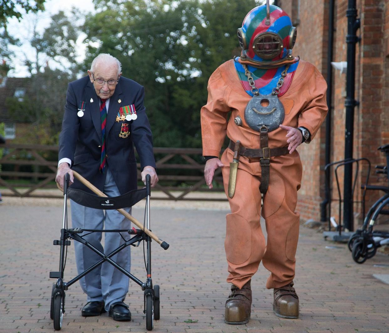 ON YOUR MARKS: Captain Sir Tom Moore is joined on his daily walk by charity fundraiser Lloyd Scott, who will next month take on the famous 3 Peaks Challenge – dressed in a deep-sea diving suit weighing 130 lbs – to raise money for disabled and disadvantaged children on behalf of the Lord’s Taverners.   Credit: Matt Impey/Lords Taverners 