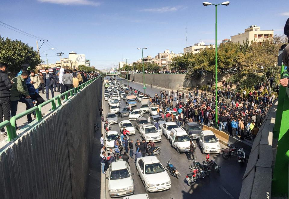 Iranian protesters block a road during a demonstration against an increase in gasoline prices in the central city of Isfahan, on Saturday: AFP/Getty