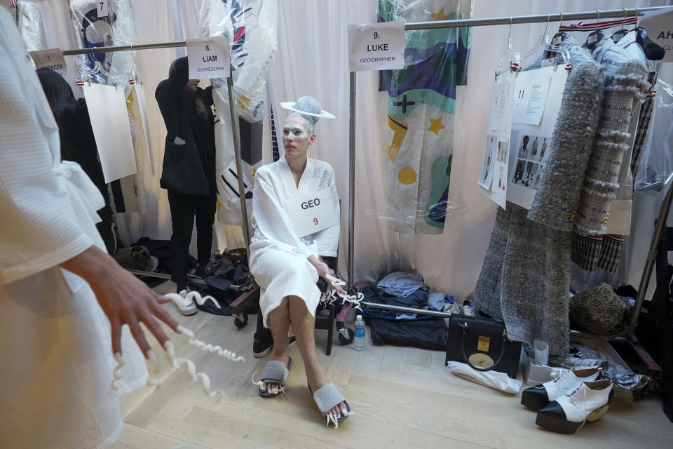 Models wait to be dressed backstage ahead of the Thom Browne collection presentation during Fashion Week, Tuesday, Feb. 14, 2023, in New York. (AP Photo/Mary Altaffer)