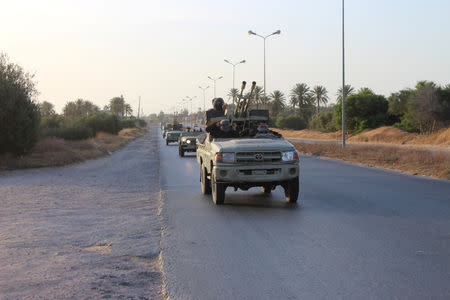 Military vehicles of members of the Libyan internationally recognised government forces head out from Misrata to front line in Tripoli, Misrata, Libya May 10, 2019. REUTERS/Ayman Al-Sahili