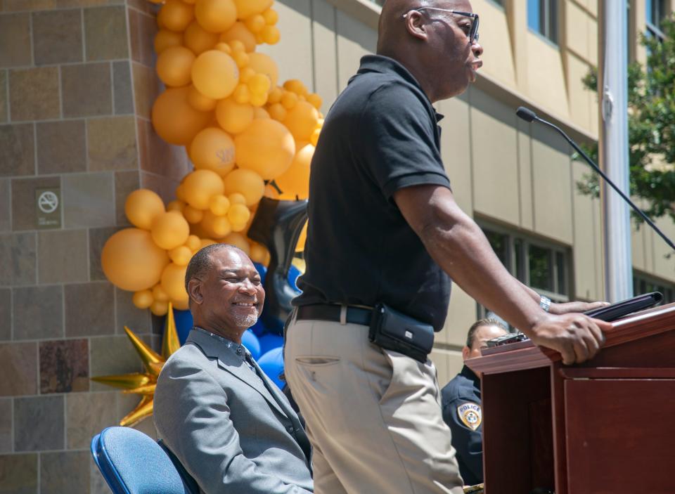 A Jazz band comprised of Chavez High music teacher Art Coleman, seated left, listens as SUSD chief business official Marcus Battle speaks at the dedication ceremony for the SUSD new administrative building named after the elder Coleman on Friday, June 17, 2022.  