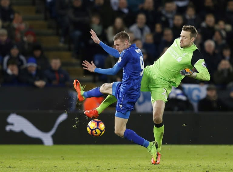 Liverpool's goalkeeper Simon Mignolet (R) clashes with Leicester City's striker Jamie Vardy at King Power Stadium in Leicester, central England on February 27, 2017