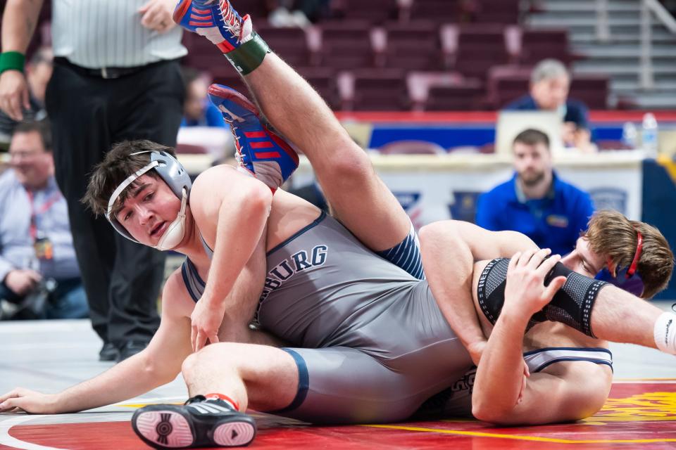Chambersburg's Aiden Hight (left) wrestles Abington Height's Caleb Marzolino in a 189-pound preliminary round bout at the PIAA Class 3A Wrestling Championships at the Giant Center on March 9, 2023, in Derry Township. Marzolino won by decision, 10-5.