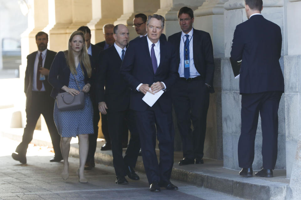 U.S. Trade Representative Robert Lighthizer, center, and members of his staff leave the U.S. Capitol, Thursday, Jan. 16, 2020. Earlier the Senate overwhelmingly approved a new North American trade agreement that rewrites the rules of trade with Canada and Mexico and gives President Donald Trump a major policy win before senators turn their full attention ti his impeachment trial. (AP Photo/Pablo Martinez Monsivais)