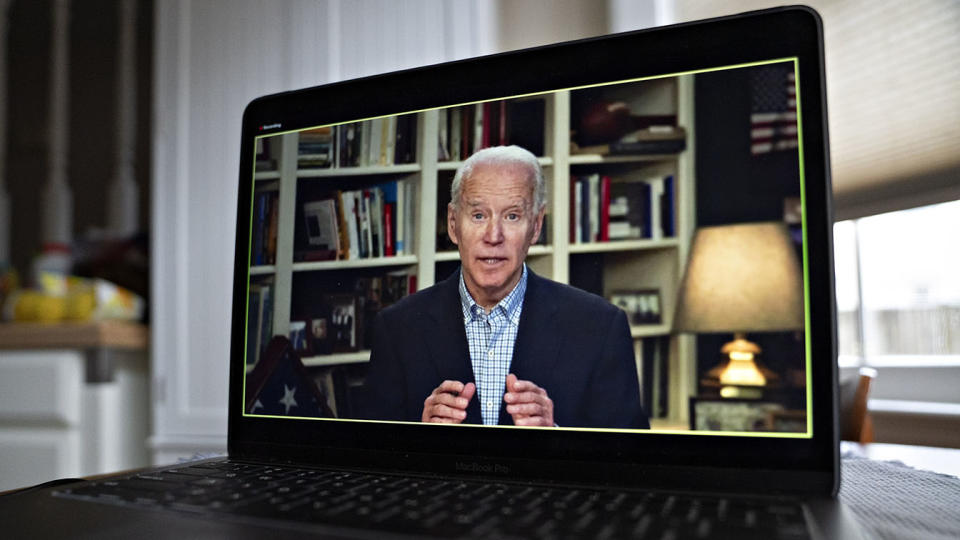 Former Vice President Joe Biden, 2020 Democratic presidential candidate, speaks during a virtual press briefing on a laptop computer in this arranged photograph in Arlington, Virginia, U.S., on Wednesday, March 25, 2020. (Andrew Harrer/Bloomberg via Getty Images)