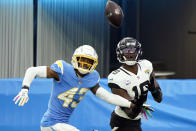 Jacksonville Jaguars wide receiver Chris Conley, right, makes a touchdown catch in front of Los Angeles Chargers cornerback Michael Davis (43) during the second half of an NFL football game Sunday, Oct. 25, 2020, in Inglewood, Calif. (AP Photo/Alex Gallardo )