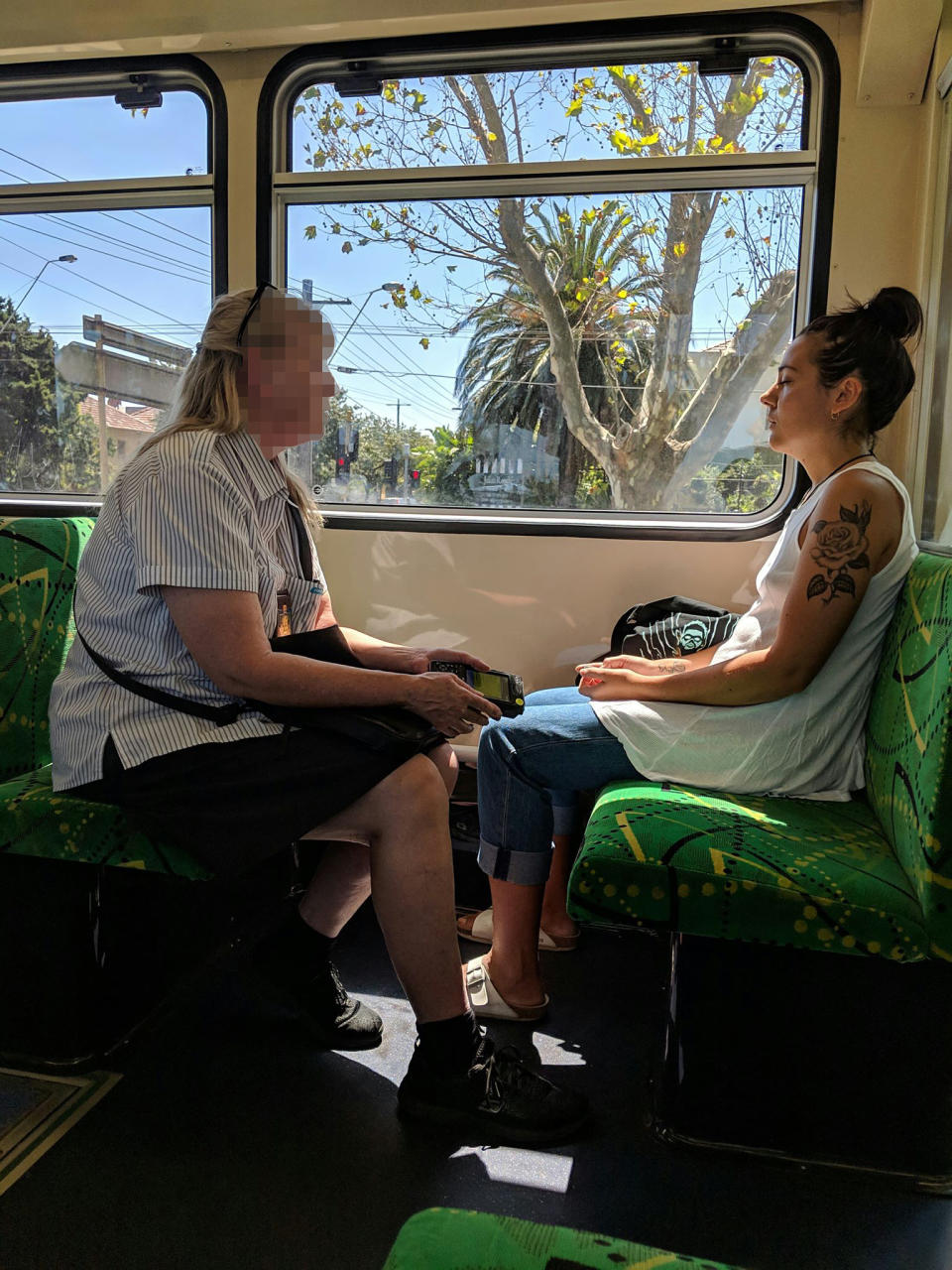 Highly amused commuters watched on as the ticket inspector tried to get Steph Athanasopoulos’ attention. Source: Supplied