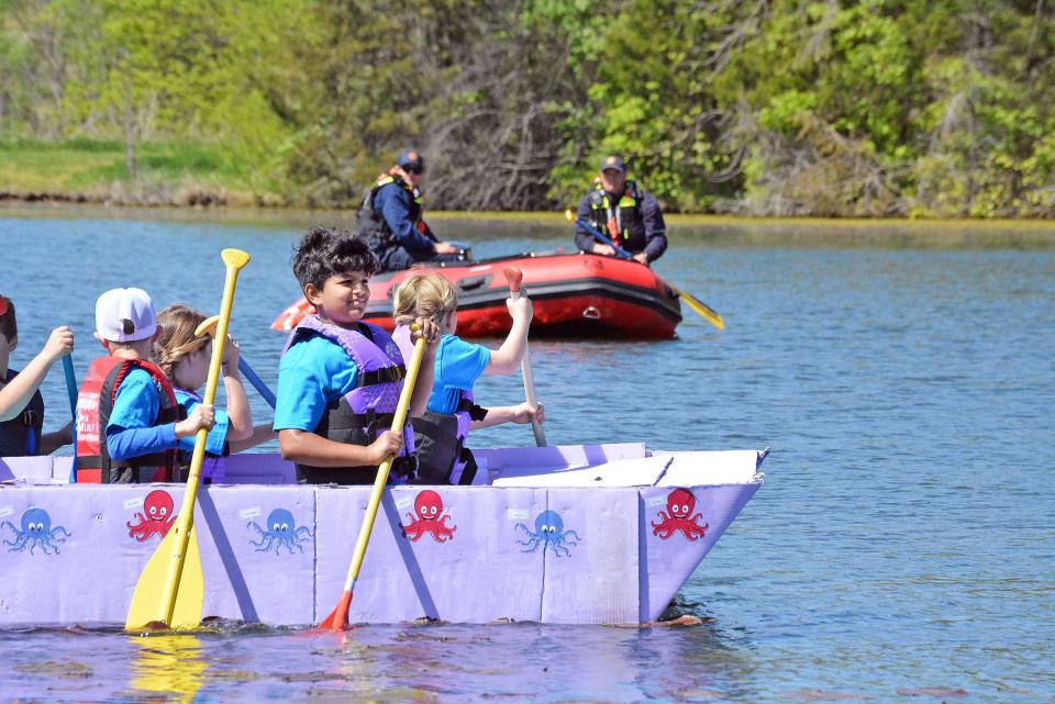 Mill Creek Elementary School students particpate Saturday in the annual Float Your Boat cardboard boat competition from the Food Bank of Central and Northeast Missouri at Bass Pro Shops lake.