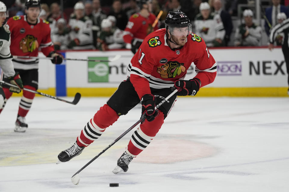 Chicago Blackhawks right wing Taylor Raddysh handles the puck during the second period of an NHL hockey game against the Minnesota Wild, Wednesday, Feb. 7, 2024, in Chicago. (AP Photo/Erin Hooley)