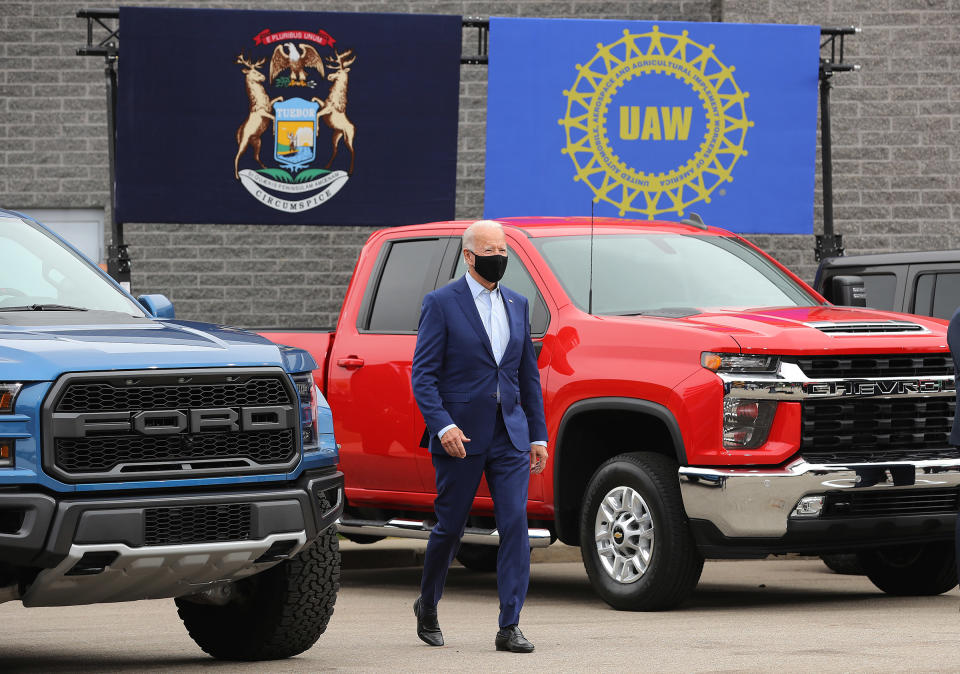 Democratic presidential nominee and former Vice President Joe Biden walks out in between pickup trucks before delivering remarks in the parking lot outside the United Auto Workers Region 1 offices in Warren, Mich., on Sept. 09, 2020.<span class="copyright">Chip Somodevilla—Getty Images</span>