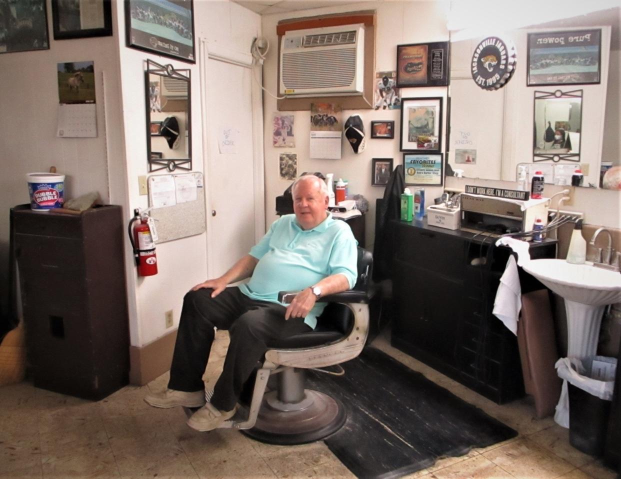 In this 2021 photo, Atlantic Beach barber Bob Thompson sits in the chair where he had cut hair for 60 years. He is retiring on Leap Day 2024, although his shop, at the corner of Atlantic Boulevard and Seminole Road, will keep going under new ownership.