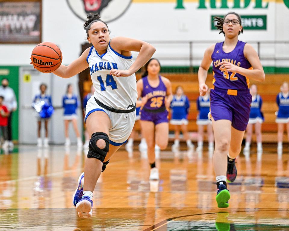 Marian’s Nevaeh Foster (24) drives to the basket in the first half against Clay Friday, Feb. 4, 2022, at Washington High School.