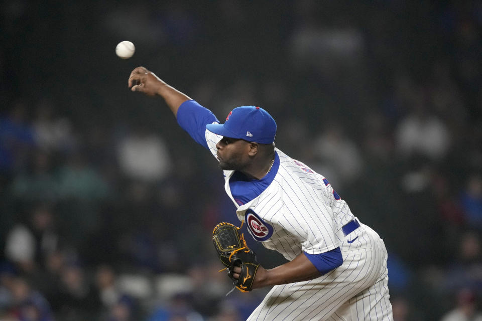 Chicago Cubs relief pitcher Héctor Neris deliver to a Cincinnati Reds batter the ninth inning of a baseball game early Sunday, June 2, 2024, in Chicago. (AP Photo/Charles Rex Arbogast)