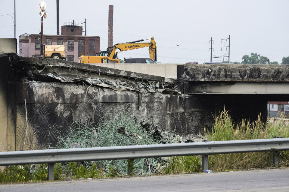 Show is the aftermath of an elevated section of Interstate 95 that collapsed, in Philadelphia, Monday, June 12, 2023. Drivers began longer commutes Monday after an elevated section of Interstate 95 collapsed in Philadelphia a day earlier following damage caused by a tanker truck carrying flammable cargo catching fire.(AP Photo/Matt Rourke)