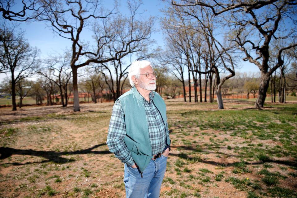 Randel Shadid stands on land in east Edmond that will be the location of a future sculpture park, The Uncommon Ground.