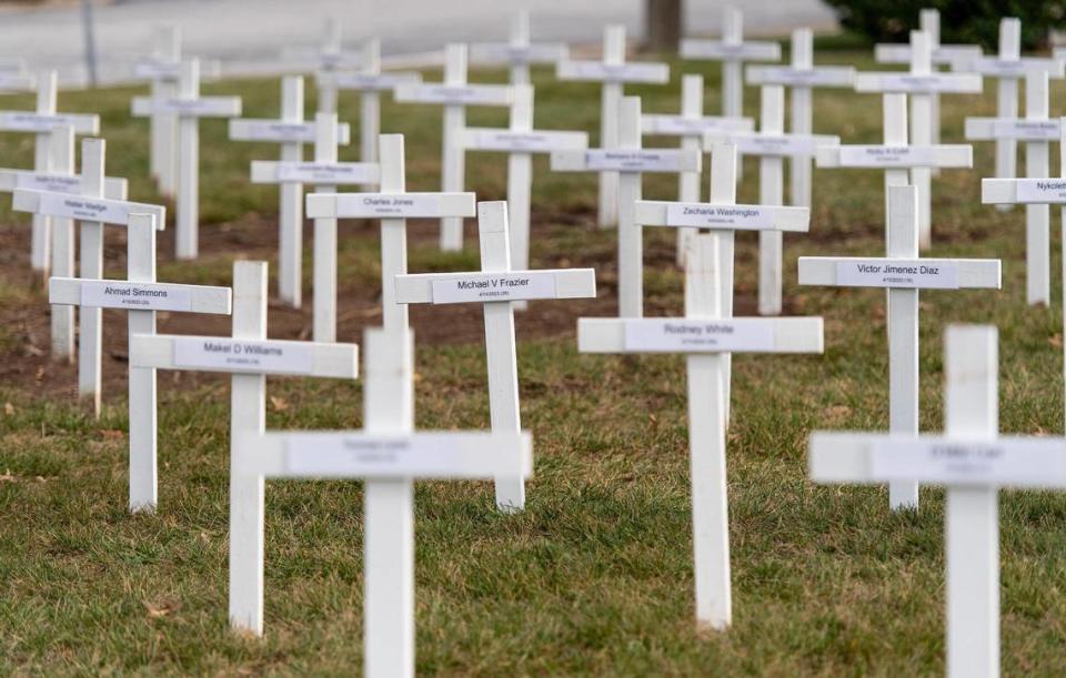 More than 170 crosses – individually marked with the names of a 2023 Kansas City homicide victim – dot the lawn outside of the Gathering Church on Wednesday, Dec. 20, 2023, in Independence, Missouri. A candlelight vigil and memorial service will be held at the church Thursday night to honor the year’s homicide victims.