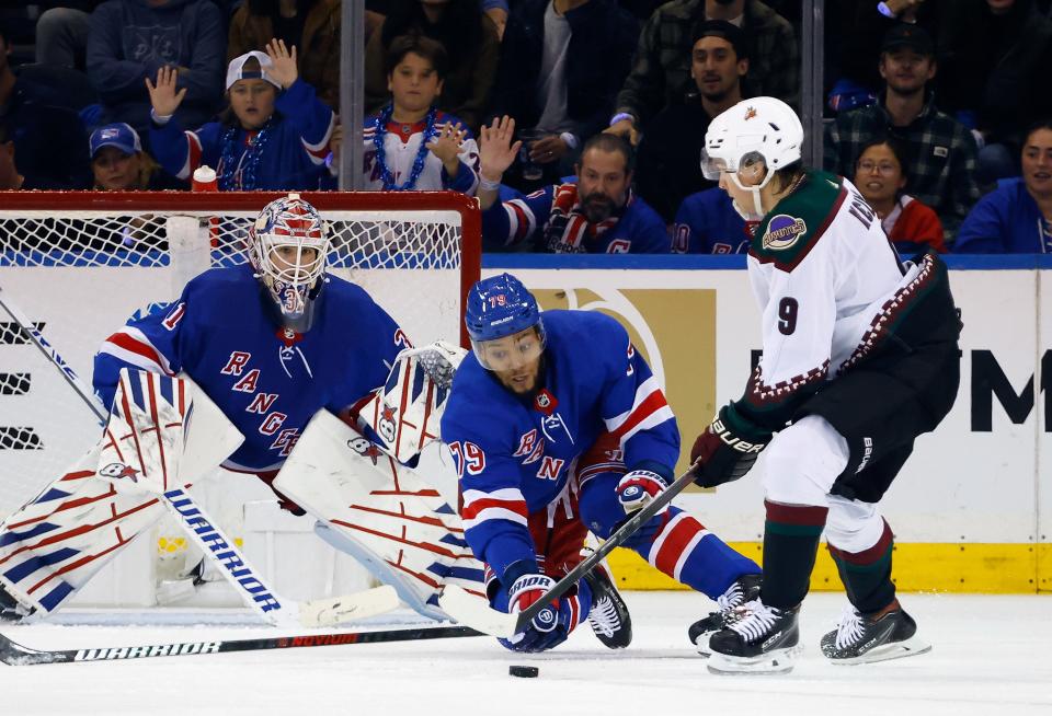 NEW YORK, NEW YORK - OCTOBER 16: Igor Shesterkin #31 and K'Andre Miller #79 of the New York Rangers defend the net against Clayton Keller #9 of the Arizona Coyotes during the second period at Madison Square Garden on October 16, 2023 in New York City.
