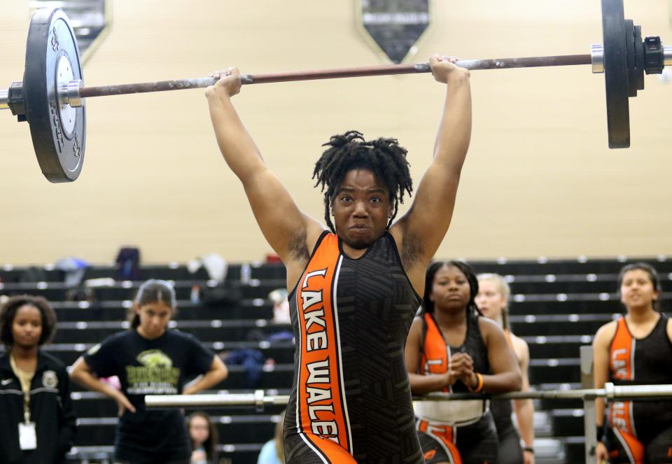 Lake Wales senior Hannah Battles completes a lift in the 139-pound weight class at the Class 2A, District 11 girls weightlifting meet at Davenport High School.