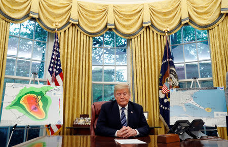 U.S. President Donald Trump holds an Oval Office meeting on hurricane preparations for Hurricane Florence at the White House in Washington, U.S., September 11, 2018. REUTERS/Leah Millis