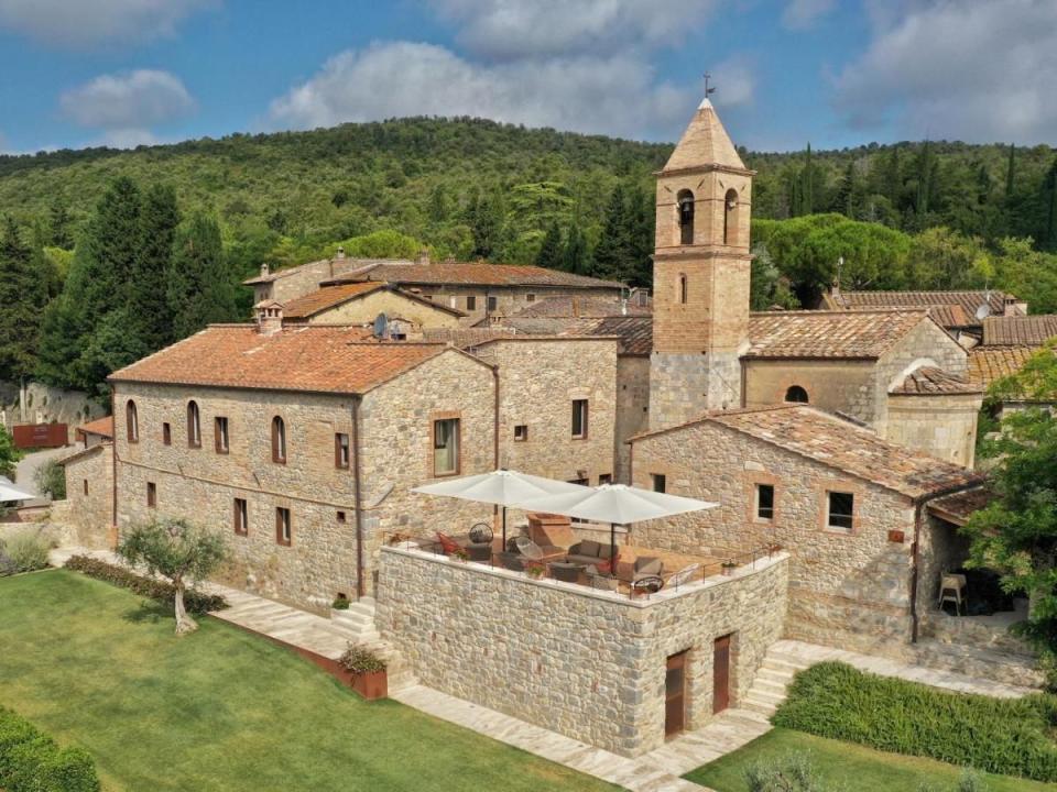 a large building with a tower and a tower with a clock on it