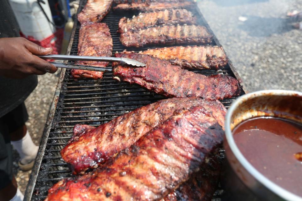 People from all over the state traveled to Canterbury Village in Lake Orion to enjoy the Michigan Rib Festival on July 02, 2022. Local and national competitors cooked up ribs along with other types of barbecued meats. Big Mac prepares ribs at Off The Bone Barbecue out of Alabama.