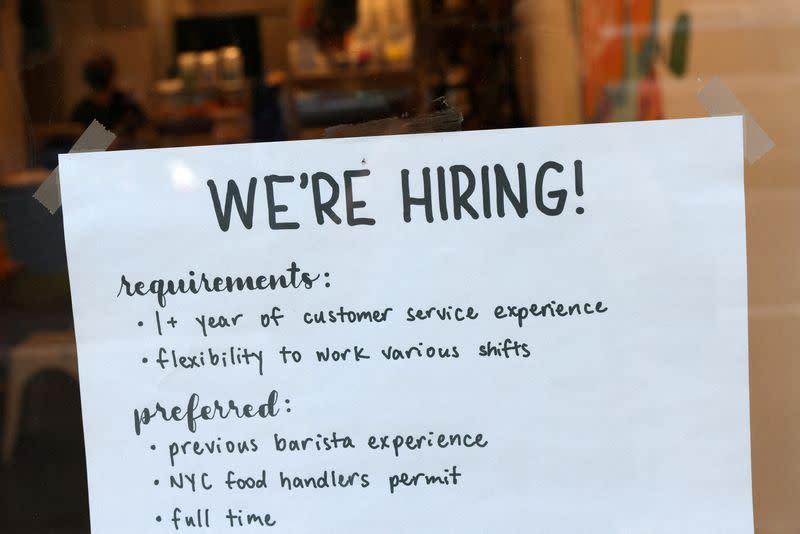 FILE PHOTO: A hiring sign is seen in a cafe in New York City