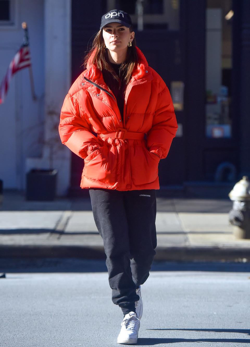 Emily Ratajkowski bundles up in a red coat while out and about in N.Y.C. on Monday. 