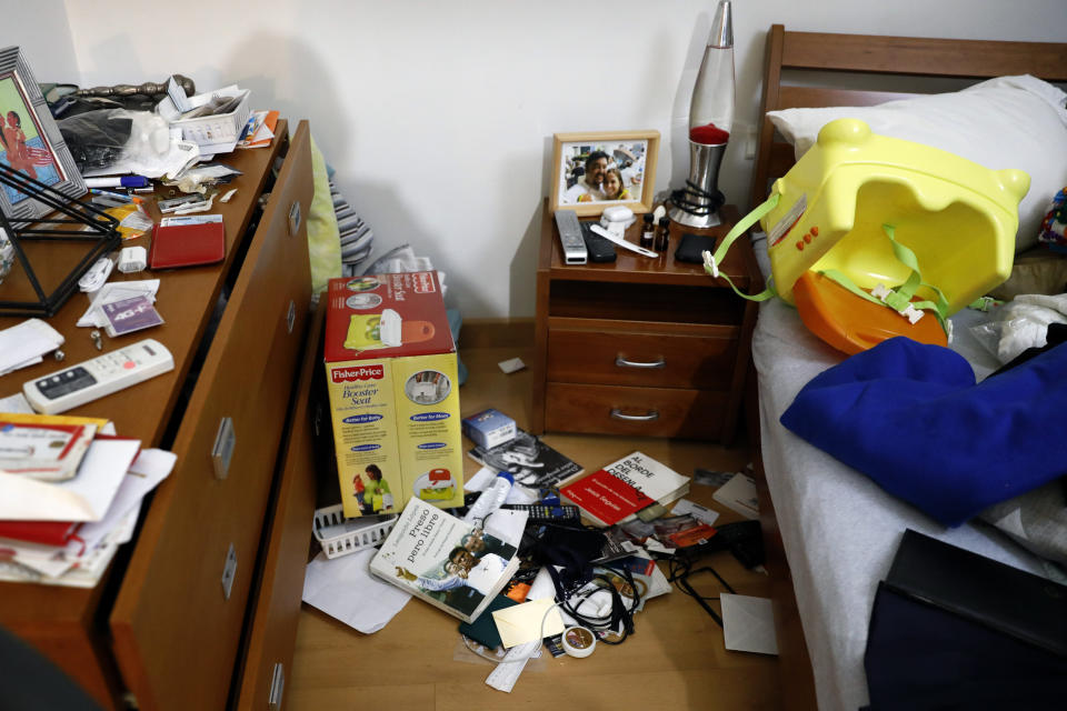 FILE - This March 21, 2019 file photo shows a bedroom in the home of Venezuelan lawyer Roberto Marrero that was left in disarray by masked security forces, in Caracas, Venezuela, Thursday, March 21, 2019. Marrero, a key aide to opposition leader Juan Guaido, was taken away by intelligence agents in an overnight operation on his home early Thursday. (AP Photo/Ariana Cubillos, File)