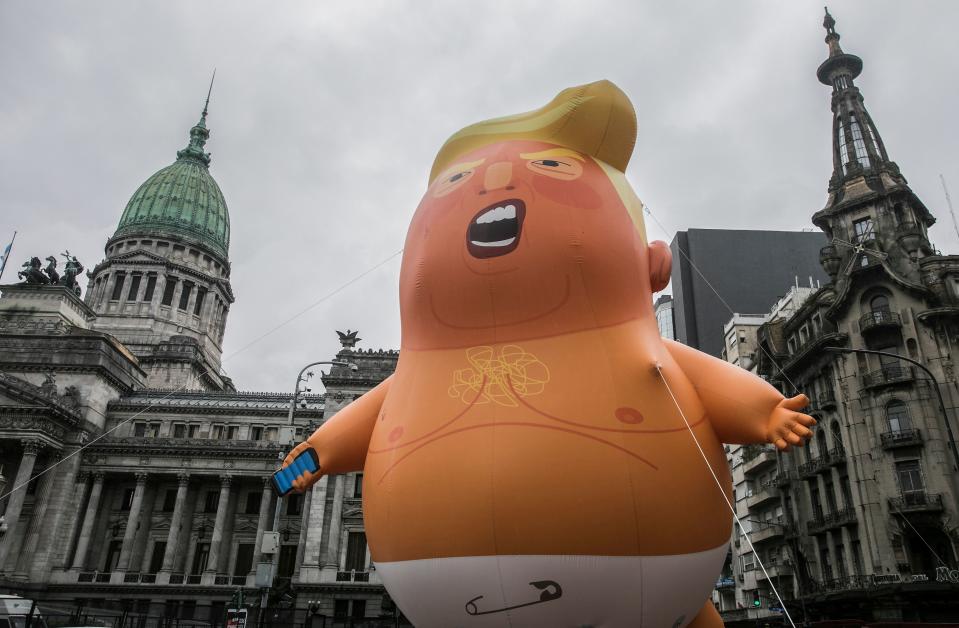 Balloon depicting President Donald Trump is seej utside the Congress building in Buenos Aires on Thursday as part of the People’s Summit. (Photo: Alberto Raggio/AFP/Getty Images)