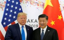 FILE PHOTO: U.S. President Donald Trump and China's President Xi Jinping pose for a photo ahead of their bilateral meeting during the 2019 G20 leaders summit in Osaka, Japan