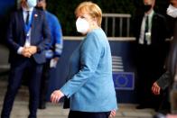 German Chancellor Angela Merkel departs an EU summit at the European Council building in Brussels