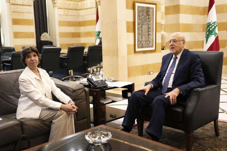 Lebanese Prime Minister Najib Mikati, right, meets with French Foreign Minister Catherine Colonna, in Beirut, Lebanon, Friday, Oct. 14, 2022. Colonna is in Beirut to meet with Lebanese officials. (AP Photo/Hussein Malla)