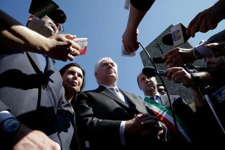 U.S. Secretary of State Rex Tillerson, (C) talks to reporters during a ceremony at the Sant'Anna di Stazzema memorial, dedicated to the victims of the massacre committed in the village of Sant'Anna di Stazzema by the Nazis in 1944 during World War II, Italy April 10, 2017. REUTERS/Max Rossi