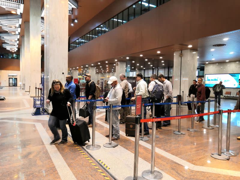 Foreign employees of oil companies, are seen leaving Iraq at the airport of Basra