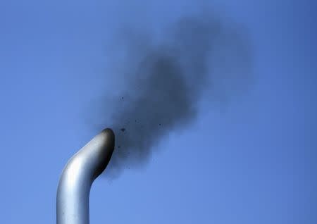 FILE PHOTO: A truck engine is tested for pollution exiting its exhaust pipe as California Air Resources field representatives (unseen) work a checkpoint set up to inspect heavy-duty trucks traveling near the Mexican-U.S. border in Otay Mesa, California September 10, 2013. REUTERS/Mike Blake