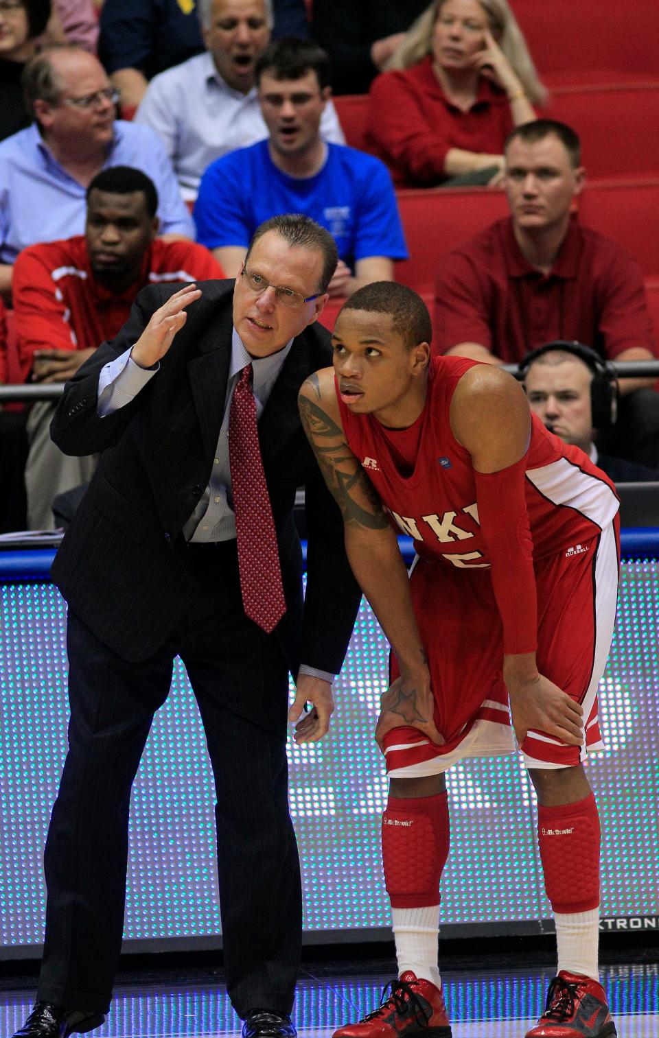 Western Kentucky head coach Ray Harper talks with guard Derrick Gordon (5) during the opening game of the NCAA college basketball tournament  against Mississippi Valley State, Tuesday, March 13, 2012, in Dayton, Ohio. (AP Photo/Al Behrman)
