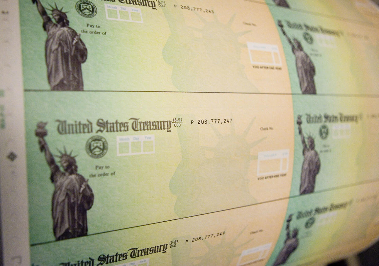 PHILADELPHIA - MAY 8:  Economic stimulus checks are prepared for printing at the Philadelphia Financial Center May 8, 2008 in Philadelphia, Pennsylvania. One hundred and thirty million households are eligible to receive a tax rebate check under the $168 billion economic stimulus plan.  (Photo by Jeff Fusco/Getty Images)