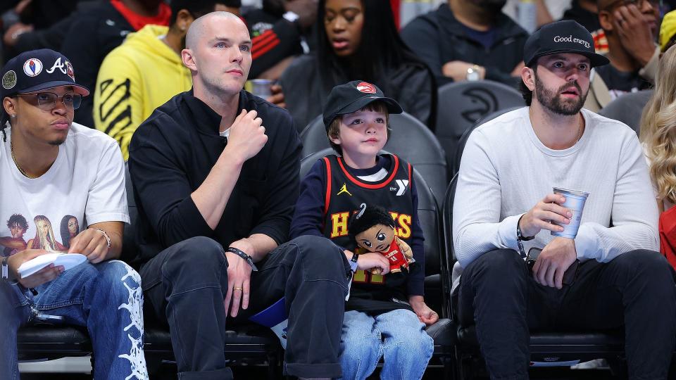 X-Men star Nicholas Hoult and his son at an NBA game in Atlanta