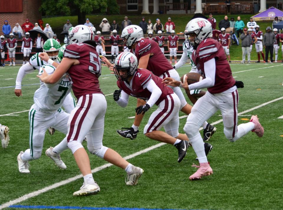 Saint James quarterback Jayden Yates is on the run against South Hagerstown during the Saints' 34-28 overtime win on Sept. 23.