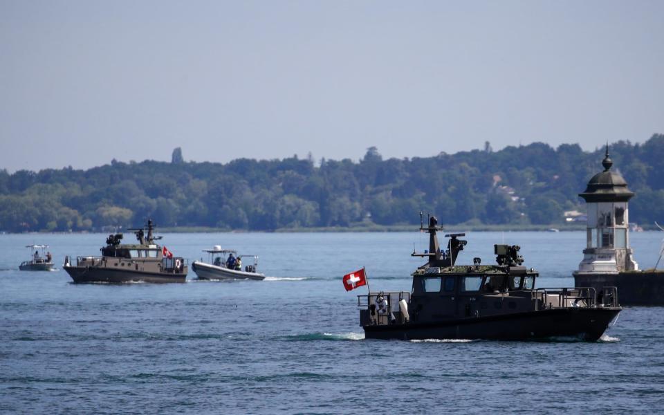 Swiss police patrol boats in Geneva - Stefan Wermuth/Bloomberg