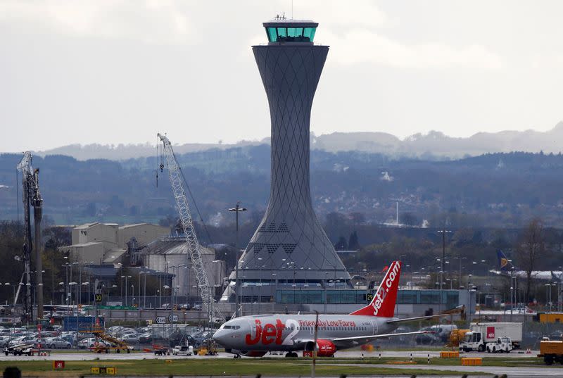 FILE PHOTO: A aircraft taxis past the control tower at Edinburgh Airport in Scotland