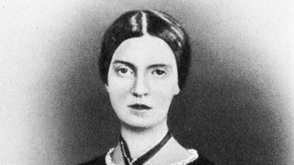 a black and white portrait photo showing emily dickinson